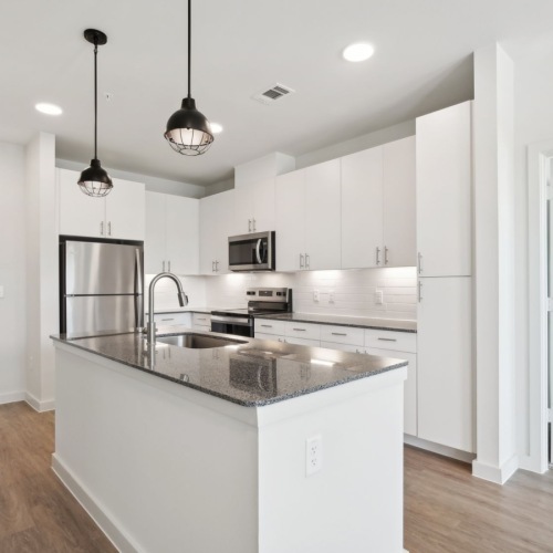 Kitchen with Island kitchen with an island, modern appliances and spacious counter-space