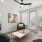 living room with seating table and ceiling fan