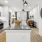 kitchen with an island, modern appliances and spacious counter-space