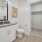 bathroom with modern finishes, a closet and ample counter-space