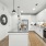 kitchen with an island, modern appliances and spacious counter-space