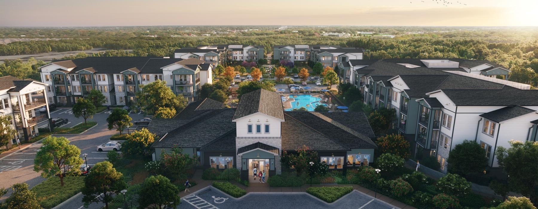 a group of apartments in a complex with lush landscaping